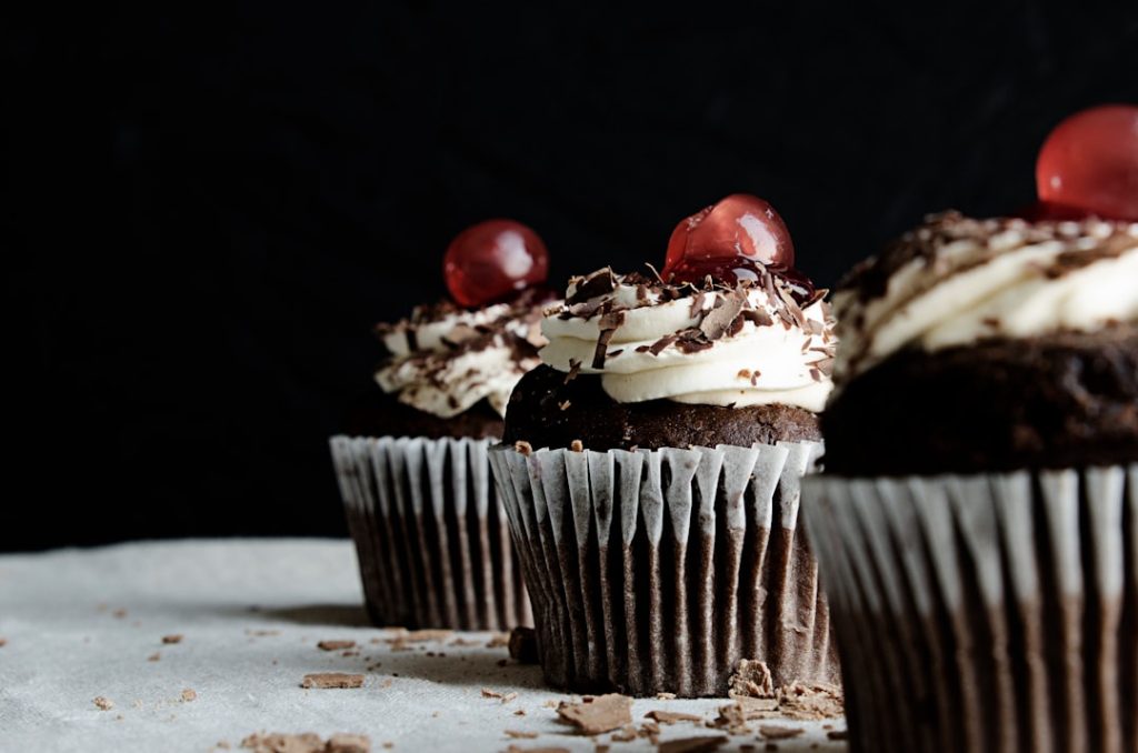 three-chocolate-cupcakes-with-cherries-vnm6-liirj0